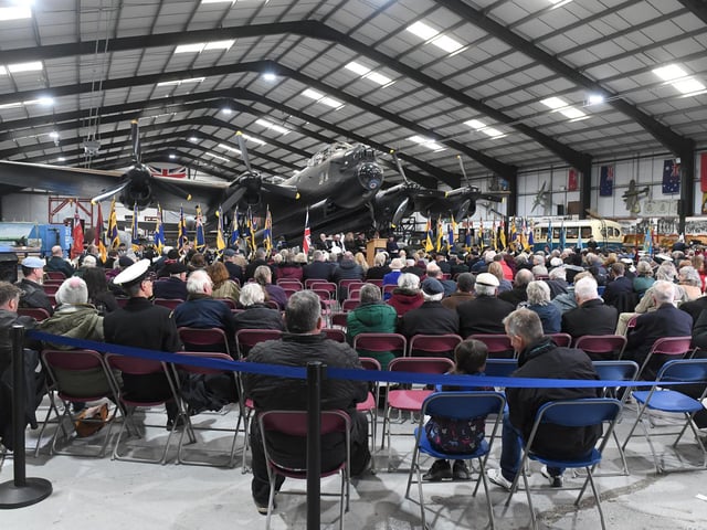 The ceremony was held under the shadow of the Just Jane Lancaster bomber.