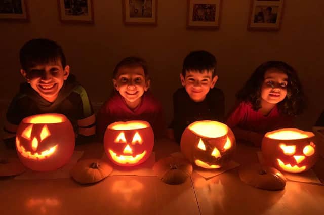 Four pumpkin carvers show us their expert work. Photo sent by Nita Mistry.