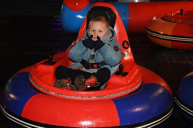 Ralph Bonham, 4, enjoys the bumper space ride.