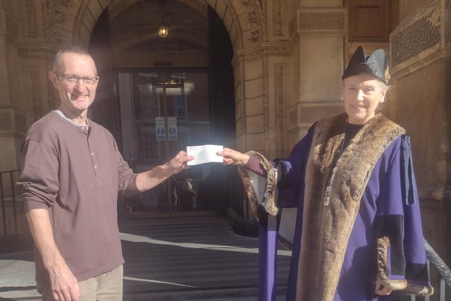 Nigel Fox is presented with his award his winning picture in the annual Leamington in Bloom photography competition. He is pictured receiving his prize cheque from  Leamington Mayor Susan Rasmussen.