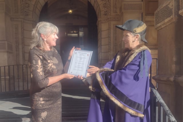 Dale Steet Methodist church receives its certificate from Leamington Mayor Susan Rasmussen.