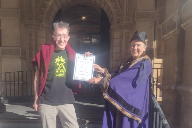 Temperance Cafe receives its Leamington in Bloom certificate from Leamington Mayor Susan Rasmussen.