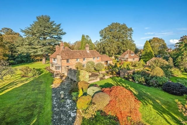 Henfield Place is located at the end of a sweeping drive and is completely surrounded by its own gardens and grounds. Picture: Jackson-Stops Lindfield.