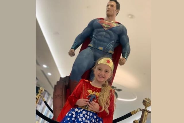 A young Superman fan got her picture taken with Superman