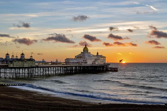 Sunrise on a mild autumn morning at Eastbourne Pier. This photograph was taken on a  Canon 5d mark iii by Barry Davis. SUS-210511-114306001