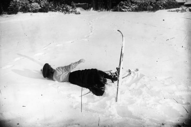 1st December 1908: A skier lies in the snow at Northampton. (Photo by Topical Press Agency/Getty Images)