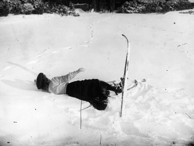 1st December 1908: A skier lies in the snow at Northampton. (Photo by Topical Press Agency/Getty Images)