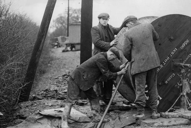 23rd February 1936: Post Office engineers in Northampton laying Britain's first television cable. (Photo by Arthur Tanner/Fox Photos/Getty Images)