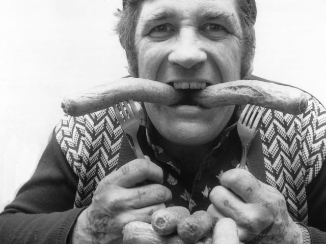 15th April 1981: Champion eater Peter Dowdeswell from Earls Barton, Northampton, tucking into a pile of sausages provided by Dunkleys meat suppliers. Peter holds more than 150 world records for eating and drinking. (Photo by Ian Tyas/Keystone Features/Getty Images)