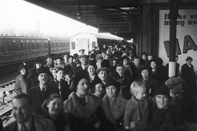 Parents and relatives of evacuees waiting for the arrival of the London Midland and Scottish Railway's Evacuation Special at Northampton railway station, 3rd December 1939. Special cheap excursions have been arranged to enable parents to visit evacuated children in the reception areas. (Photo by J. A. Hampton/Topical Press Agency/Hulton Archive/Getty Images)