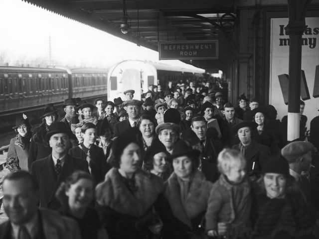 Parents and relatives of evacuees waiting for the arrival of the London Midland and Scottish Railway's Evacuation Special at Northampton railway station, 3rd December 1939. Special cheap excursions have been arranged to enable parents to visit evacuated children in the reception areas. (Photo by J. A. Hampton/Topical Press Agency/Hulton Archive/Getty Images)