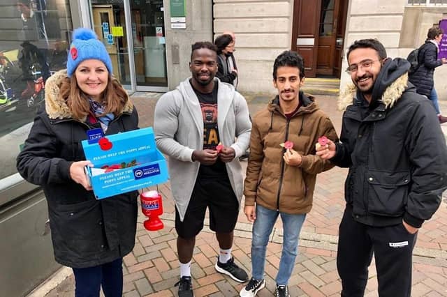 Eastbourne MP Caroline Ansell sells poppies in the town centre