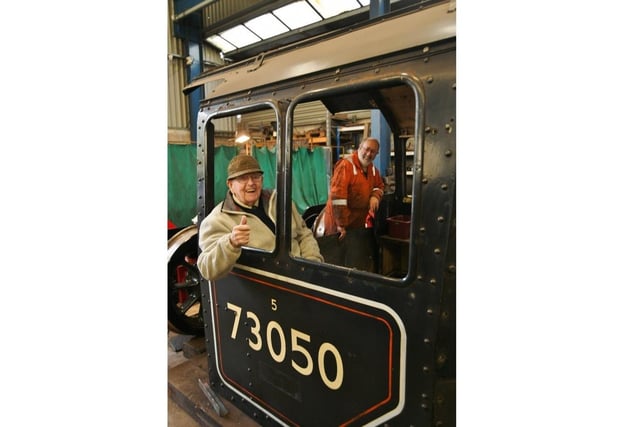 George in the cabin of the locomotive.