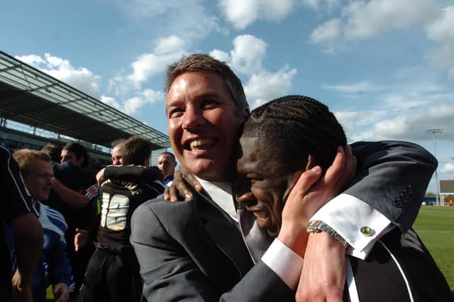Darren Ferguson celebrates with Aaron McLean after beating Colchester.