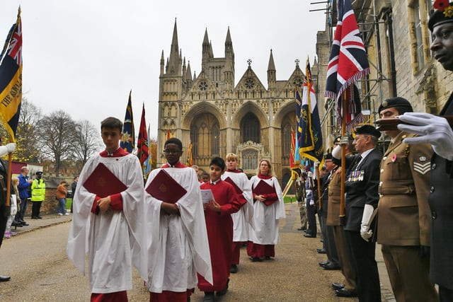 The procession from the Service of Remembrance at Peterborough Cathedral. Mayor of Peterborough Steve Lane takes the salute EMN-211114-132840009
