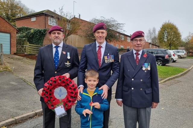 Three service members of the armed forces prepare to lay a wreath at the Woodford Halse Remembrance Sunday service (photo from Kevin Smith)