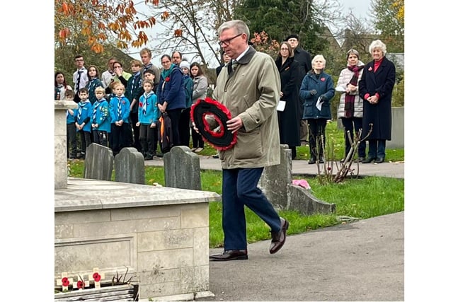Deputy leader Cherwell District Council Ian Corkin lays a wreath at the Upper Heyford Remembrance Sunday service on November 14 (Image from Ian Corkin Tweet)