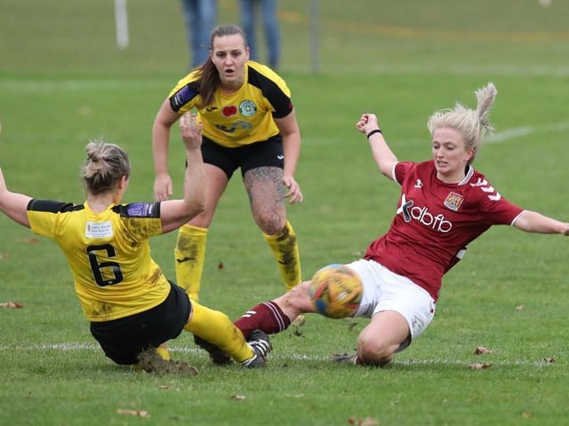 Northampton's Rachael Mumford goes in for a full-bloodied challenge with Amanda Whalley.