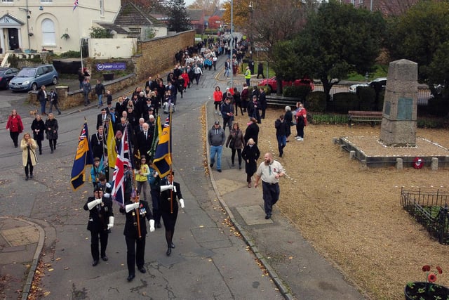 The remembrance parade makes it way to St Giles Church in Desborough.