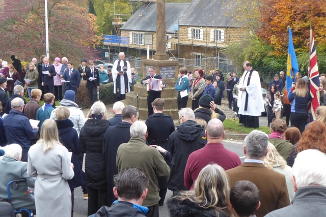 A crowd of people gathers in the village of Bloxham on Remembrance Sunday (photo from Alan Griffin)