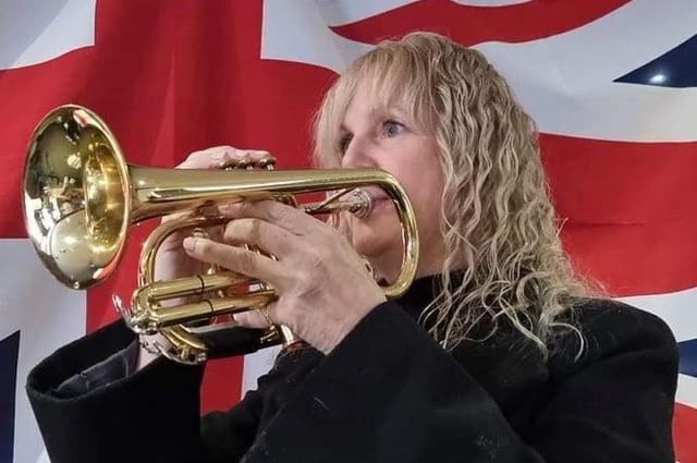 Lynette Wild plays the Last Post in Woodford Halse.