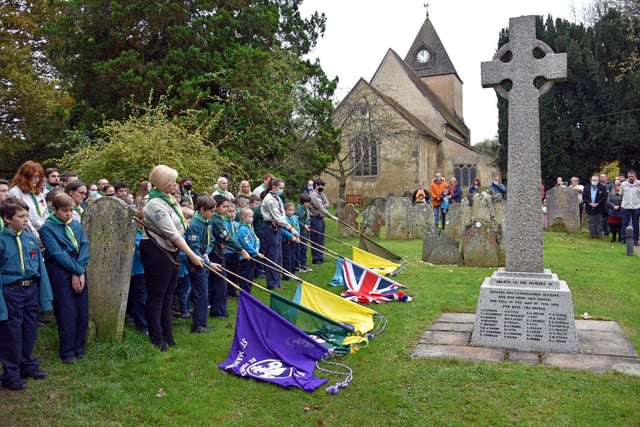 The 2nd Ifield Scout Group lower the colours during the two minutes silence