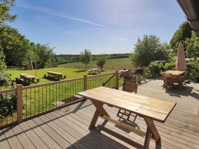 An outside terrace overlooking the vineyard estate. SUS-211116-083319001