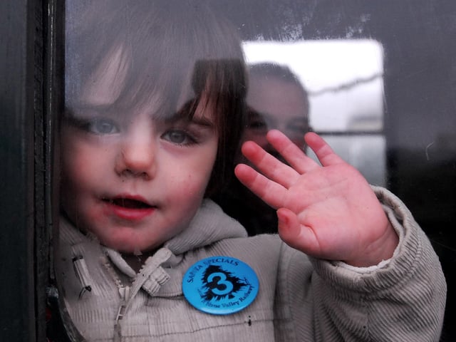 Lewis Parks (3) waves as the train departs