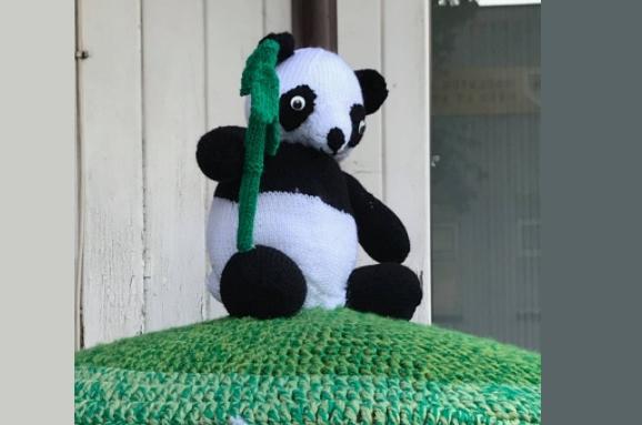 There is a panda postbox topper