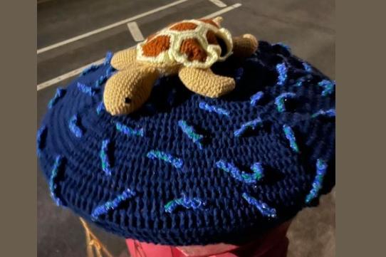 This postbox topper has a sea turtle on it