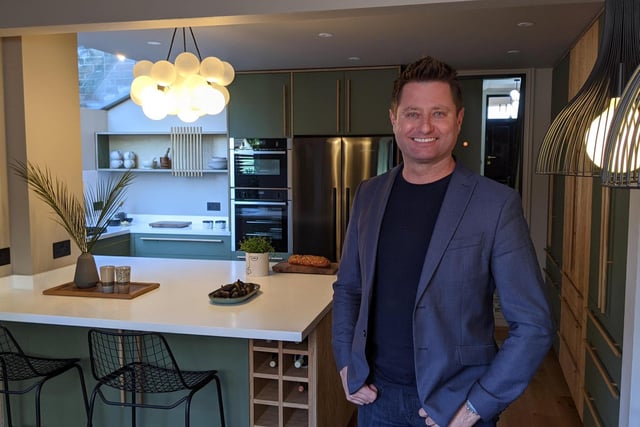 George Clarke standing in the completed kitchen. Photo: Channel 4