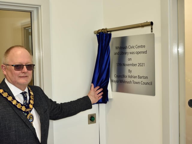 Whitnash mayor Cllr Adrian Barton unveils the plaque for the opening of the new Whitnash Civic Centre and Library.