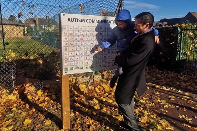 Dan and Josh using the autism communication board.