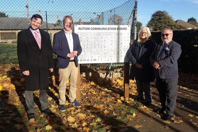 Dan Harris, MP for Peterborough Paul Bristow and local councillors Cllr Lynne Ayres and Cllr Wayne Fitzgerald at the unveiling of the board.