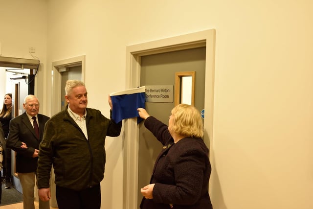 Cllr Judy Falp and Bernard Kirton's son Mark unveil the plaque for the Bernard Kirton conference room at the new Whitnash Civic Centre and Library.