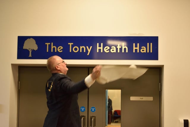 Whitnash mayor Cllr Adrian Barton unveils the sign for the Tony Heath Hall at the new Whitnash Civic Centre and Library.