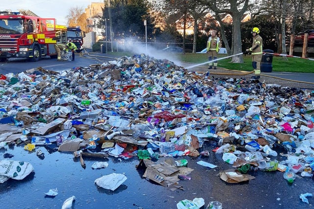 Quick-thinking bin men emptied the contents of their lorry into the road after spotting the blaze