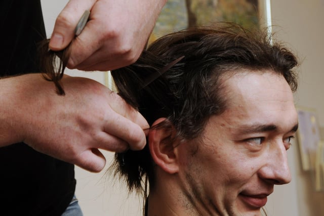 Ben Hollatz has his haircut by Chris Boxter for Children in Need 2011. Pictures: Stephen Goodger