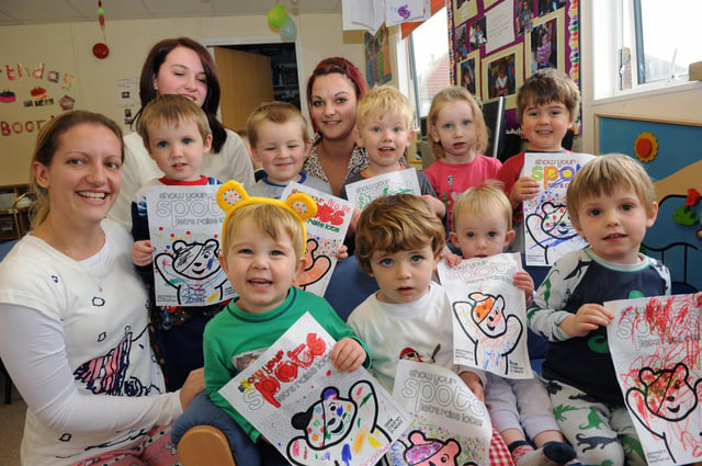 Staff and children at Davison Day Nursery in 2011 with their Children in Need posters. Picture: Stephen Goodger W47590H11