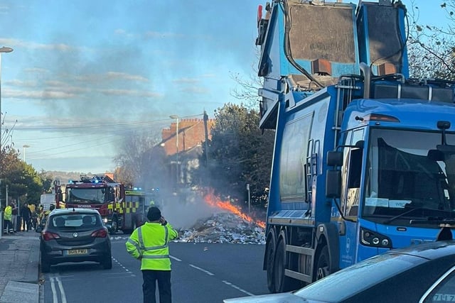 Binmen had to act quickly and dump the flaming contents of the refuse lorry into the road to stop the whole lorry being set alight