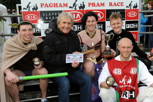 Pagham Boxing Day Pram Race. derek Bell hands out the first place prize to team Star H Wars.  Pic Steve Robards SR1529335 SUS-151228-121536001
