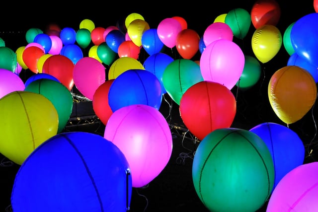 Celebrations is a uniquely poignant installation of 100 giant balloons lit from the neck on electro fluorescent wire ‘strings’ that appear to float and glow in the darkness.