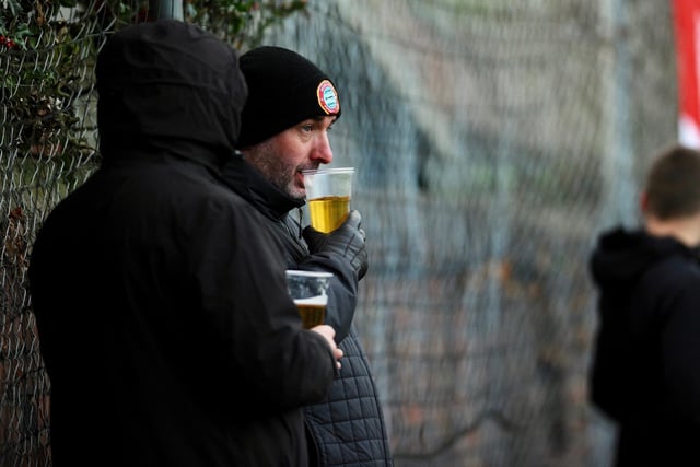 Fans sup up at the home defeat to Dorking Wanderers in the FA Trophy / Pictures: Stephen Goodger