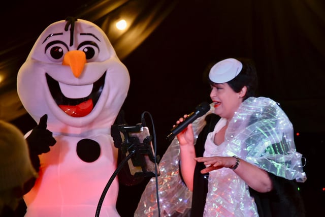Olaf the snowman delighting the crowds with singer Tania Rodd