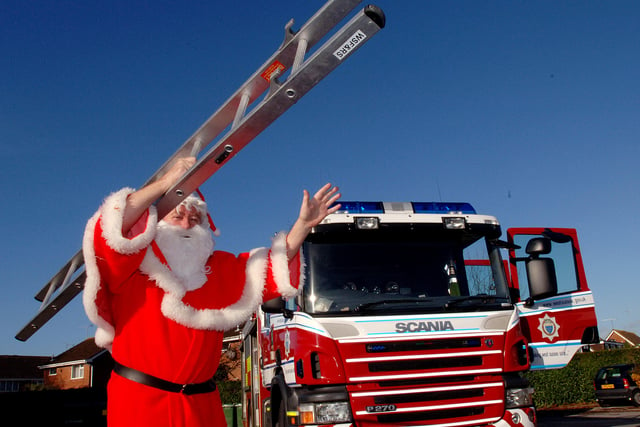 Father Christmas travelled by fire engine to get to the St Barnabas hospice Christmas fayre in December 2007. Picture: Stephen Goodger