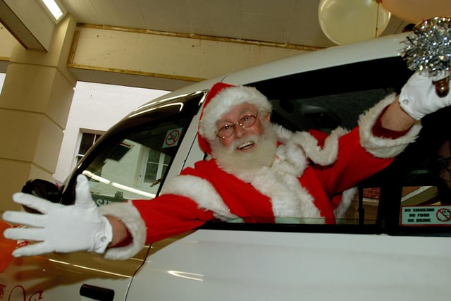 Father Christmas arrived at the Guidbourne Centre in the back of a white taxi on December 15, 2007, and was greeted by Robin Hood. Pictures: Stephen Goodger
