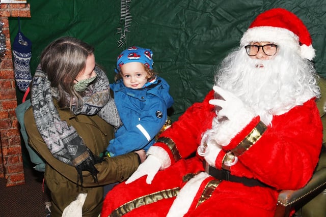 Quentin Madeira II and his mum Mitzi Hooper with Father Christmas