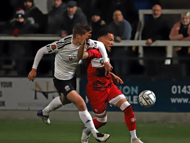 Rhys Sharpe battles for possession