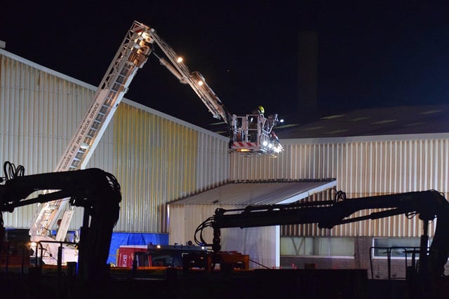 Firefighters at the scene last night. Picture by Dan Jessup SUS-210212-110545001