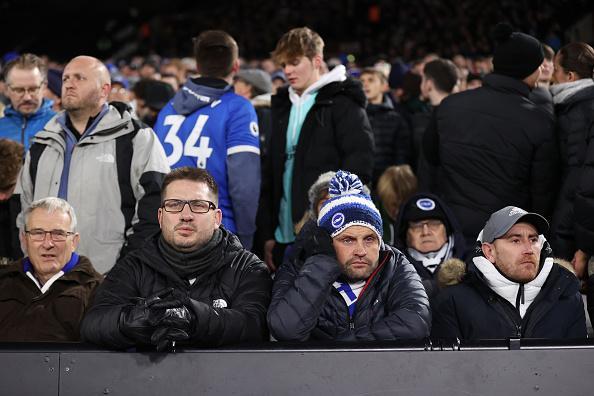 Brighton fans look dejected after West Ham's early goal